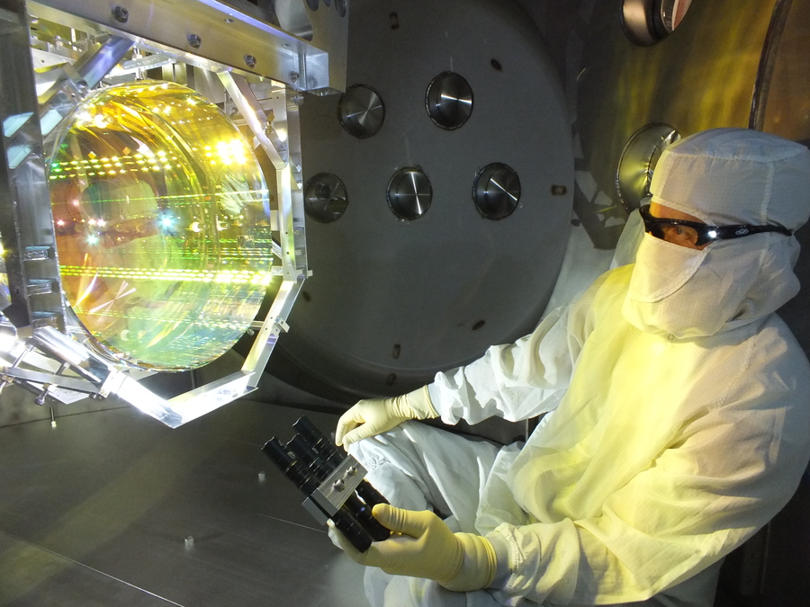 LIGO scientist inspects optics