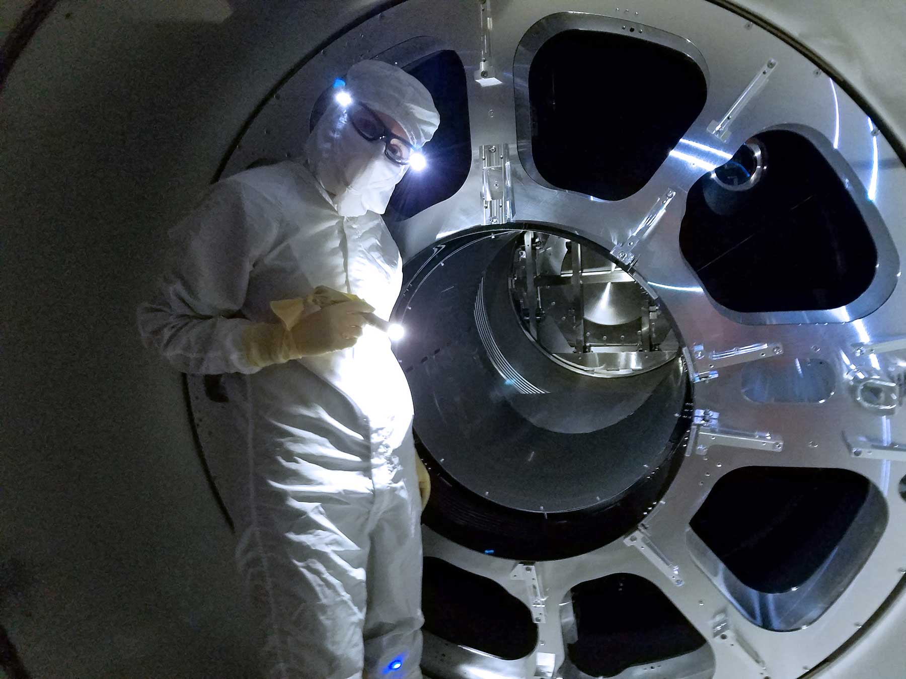LIGO team member Alena Ananyeva is seen at LIGO Livingston Observatory installing new baffles on part of the LIGO instrument that controls stray light. These upgrades were made in preparation for Advanced LIGO's third observing run. Image credit: LIGO/Caltech/MIT/Matt Heintze